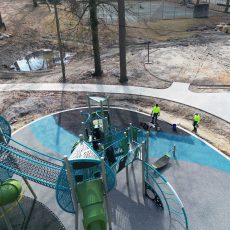 Replay Surfacing professionals applying poured in place rubber surfacing outdoors to create slip-resistant, cushioned surfaces